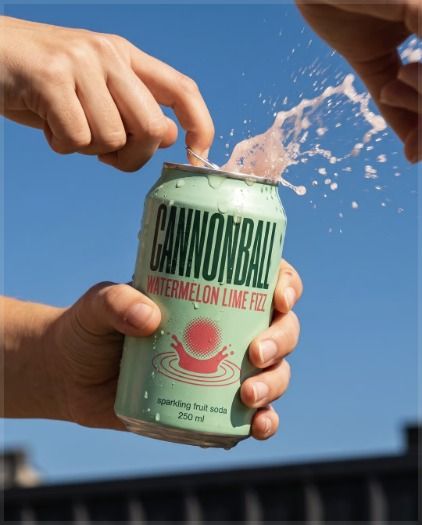 Soda can opened with a splash